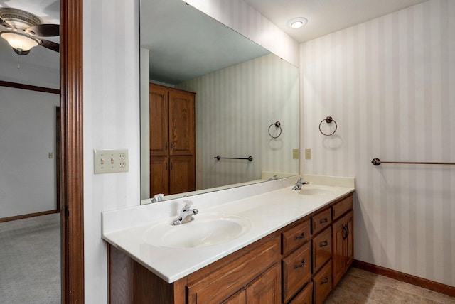 bathroom with ceiling fan and vanity