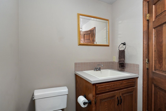 bathroom with toilet and vanity