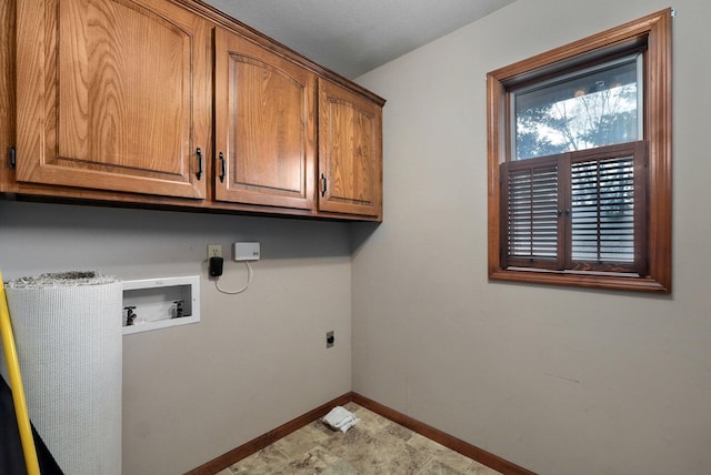 laundry room with washer hookup, cabinets, and electric dryer hookup