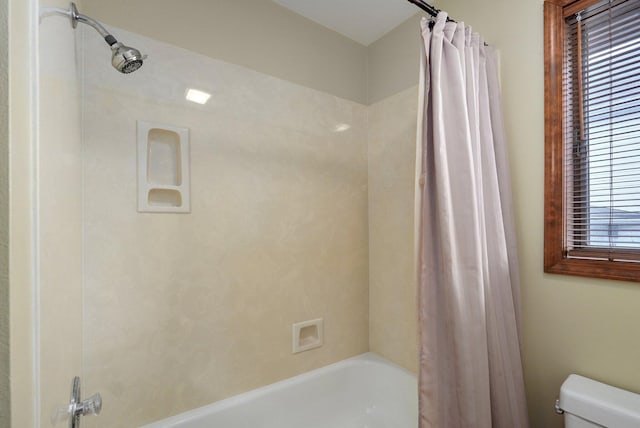 bathroom with toilet and shower / tub combo with curtain