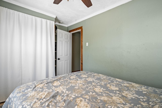 bedroom featuring ceiling fan and crown molding