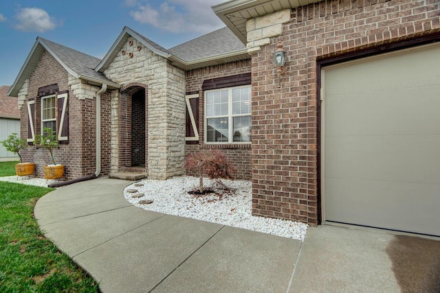 view of exterior entry featuring a garage