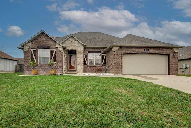 view of front of home featuring a garage and a front lawn