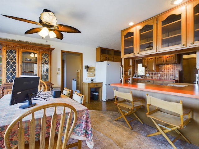 dining space featuring ceiling fan