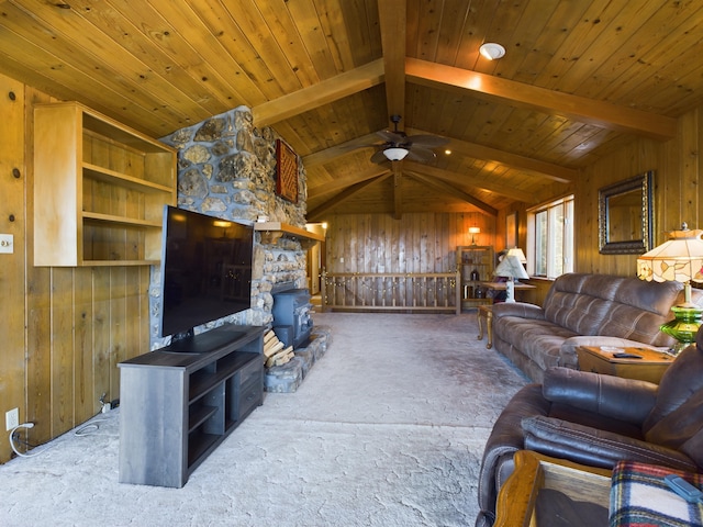 living room featuring wooden walls, carpet floors, and ceiling fan