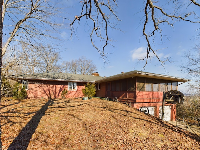 view of front of house with a sunroom