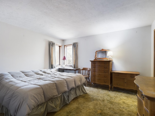 carpeted bedroom featuring a textured ceiling