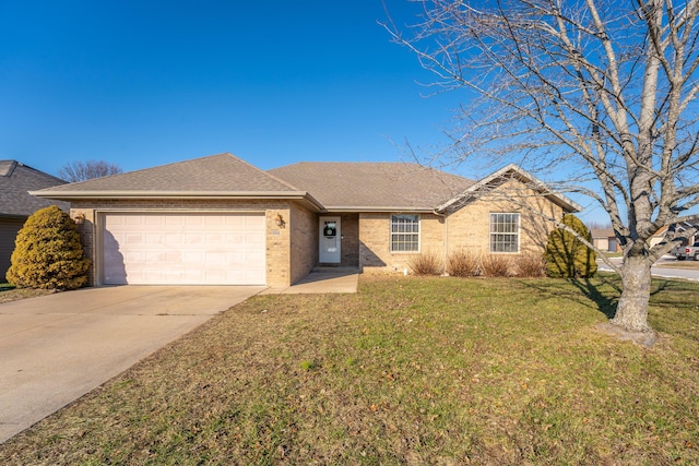 single story home with a garage and a front lawn