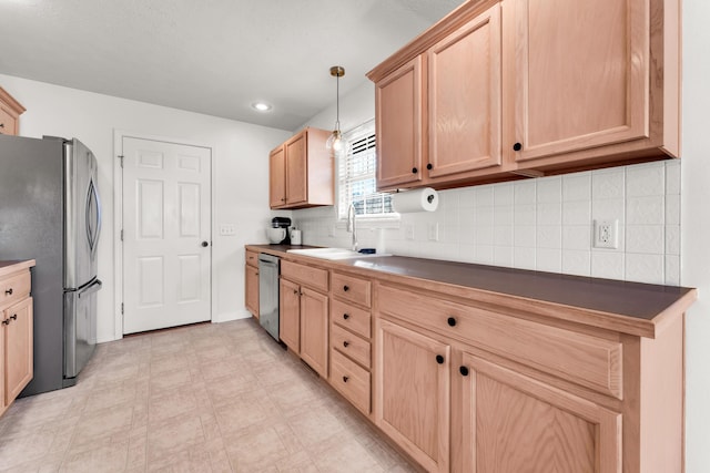 kitchen featuring tasteful backsplash, sink, hanging light fixtures, appliances with stainless steel finishes, and light brown cabinets