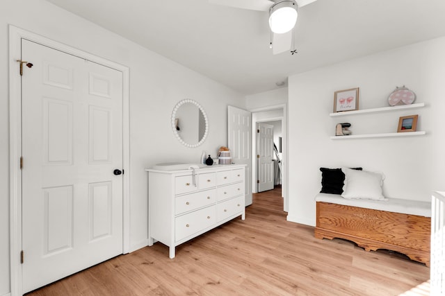 bedroom with light wood-type flooring and ceiling fan