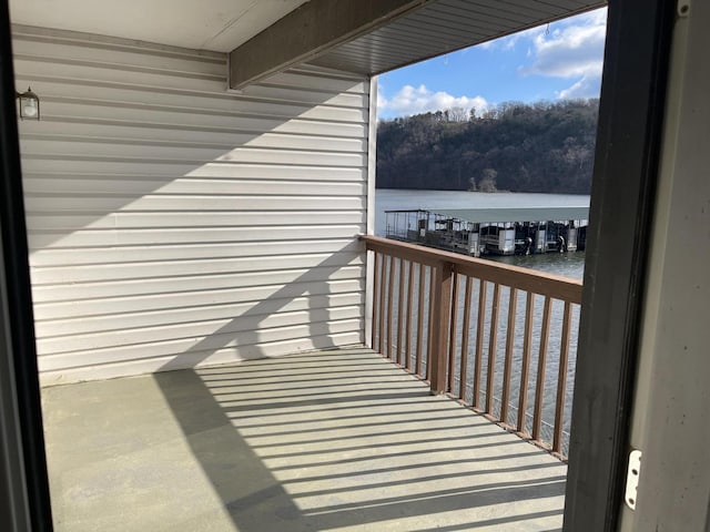 balcony featuring a water view