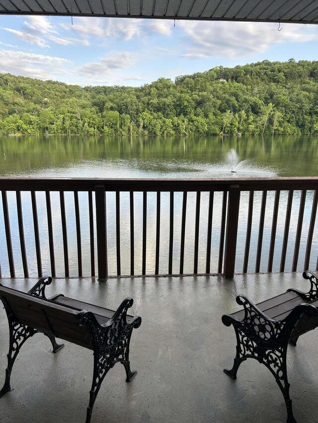 2529 State Highway 176 Unit 5, Rockaway Beach, MO 65740 - balcony featuring a view of trees and a water view