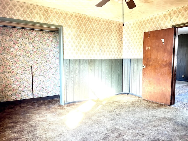 unfurnished room featuring carpet floors and ceiling fan