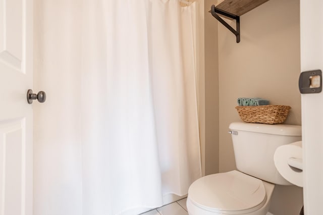 bathroom featuring toilet and tile patterned floors