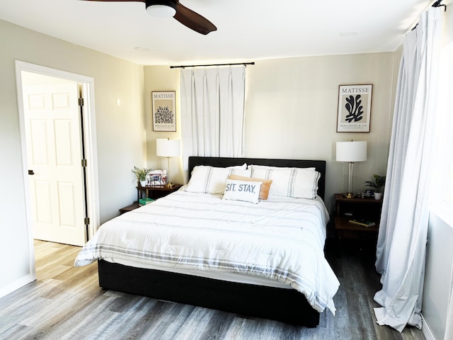 bedroom with ceiling fan and wood-type flooring