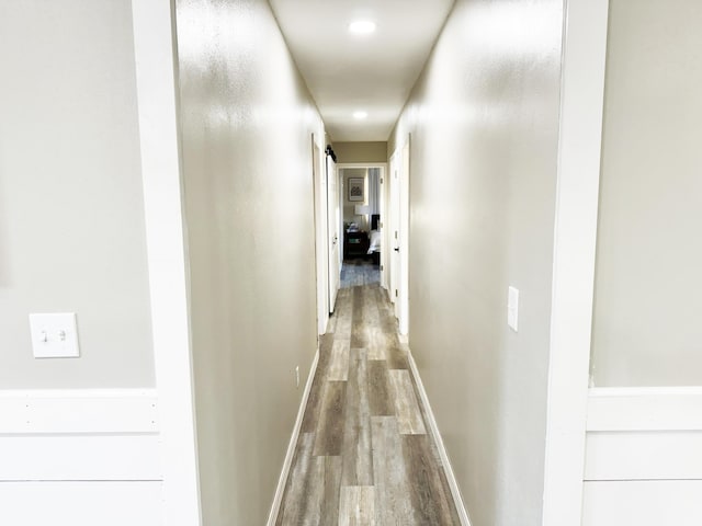 corridor featuring hardwood / wood-style flooring