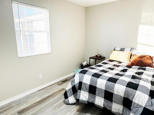 bedroom featuring light hardwood / wood-style floors