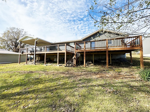 back of house with a lawn, ceiling fan, and a wooden deck