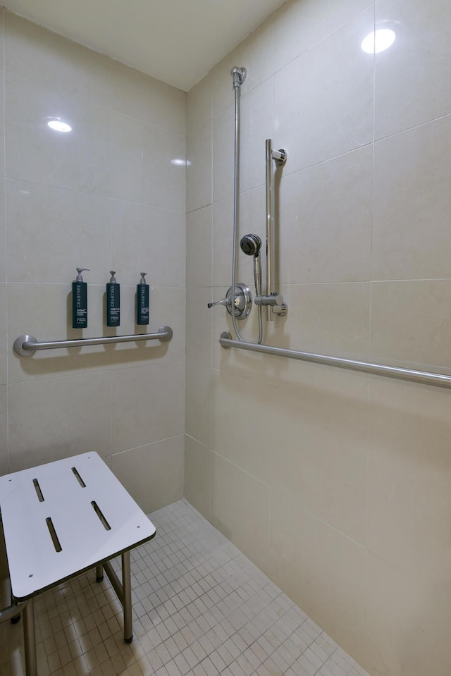 bathroom with a tile shower