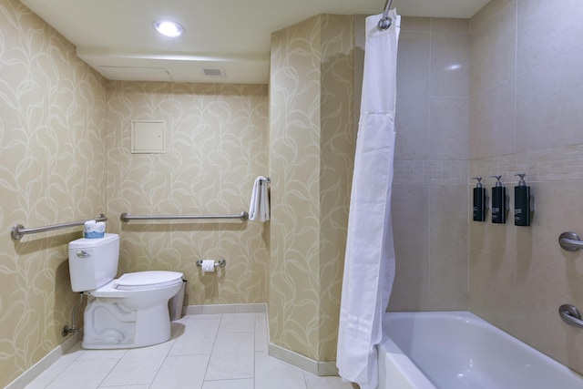 bathroom with toilet, tile patterned floors, and shower / bath combo with shower curtain