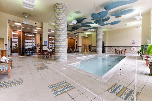 view of pool with a patio and ceiling fan