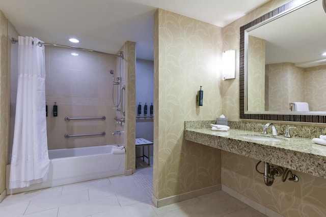 bathroom with sink, tile patterned floors, and shower / bath combo with shower curtain