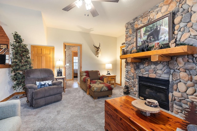 living room with a fireplace, ceiling fan, and light colored carpet