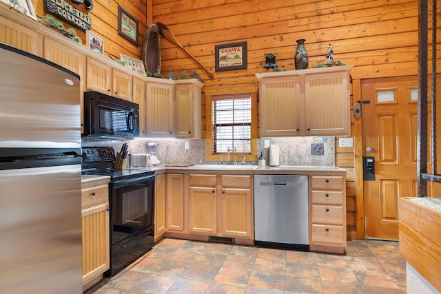 kitchen with backsplash, black appliances, light brown cabinets, and sink