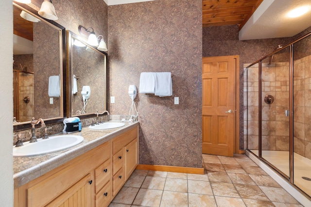 bathroom featuring vanity, walk in shower, and wood ceiling