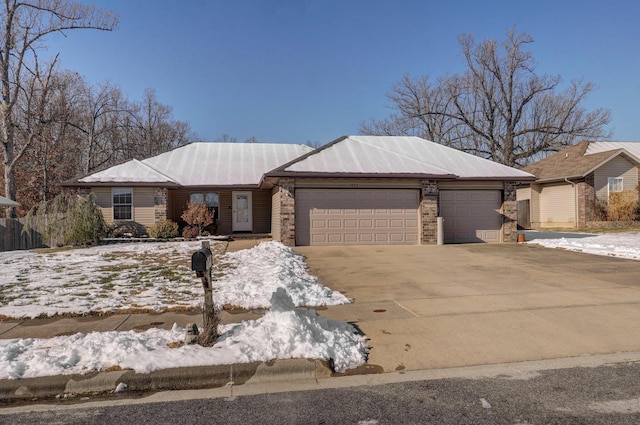 ranch-style home featuring a garage