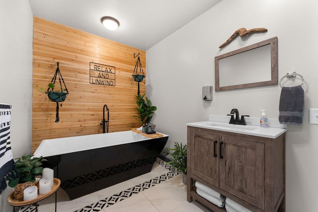 bathroom with tile patterned flooring, vanity, a bathtub, and wood walls