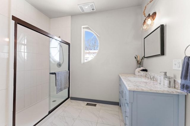 bathroom with an enclosed shower and vanity