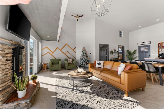 living room featuring a fireplace and a chandelier