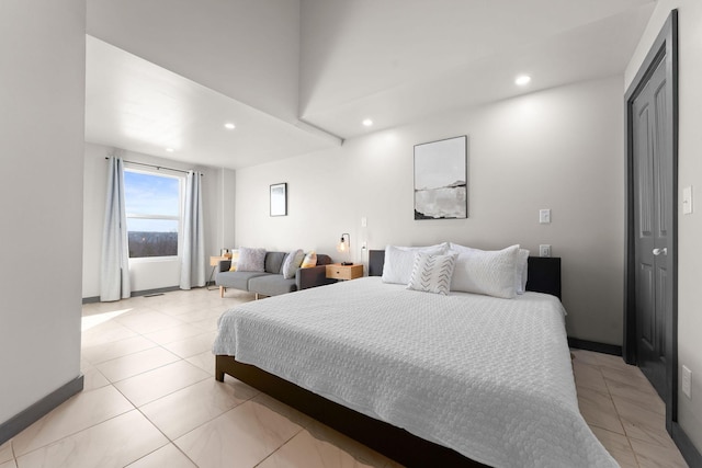 bedroom with light tile patterned floors