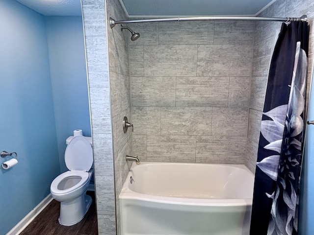 bathroom featuring toilet, shower / bathtub combination with curtain, and hardwood / wood-style flooring