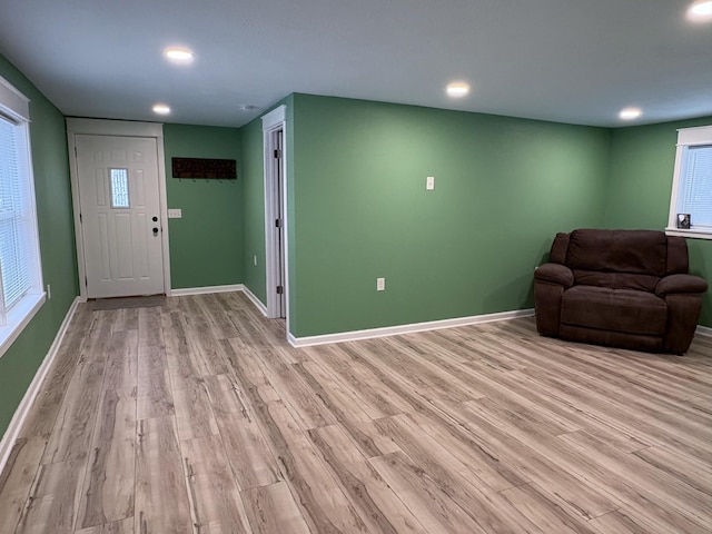 unfurnished living room featuring light wood-type flooring