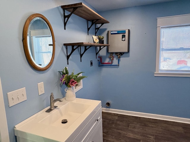 bathroom with vanity and hardwood / wood-style flooring