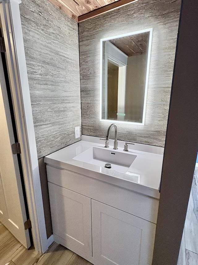 bathroom with wood-type flooring and vanity