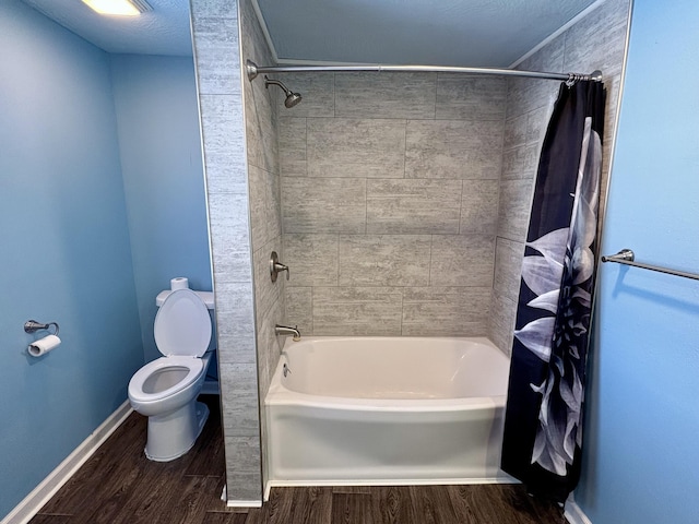 bathroom with hardwood / wood-style flooring, toilet, and shower / bath combo