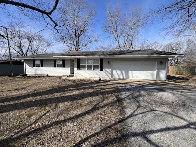 ranch-style house featuring a garage