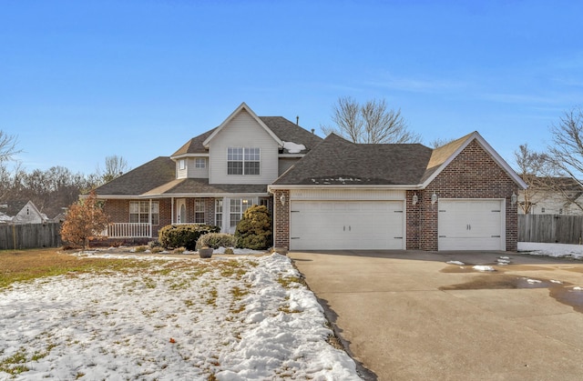 view of front of property with a garage and a porch