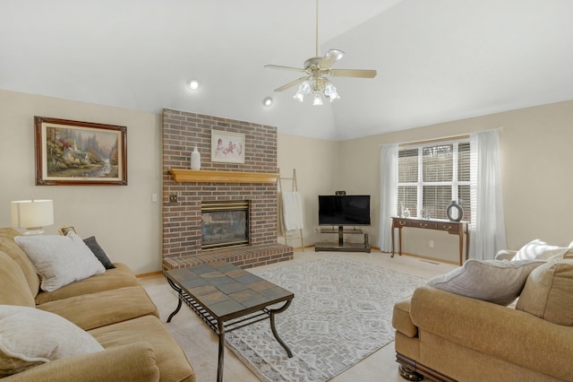 living room featuring ceiling fan, vaulted ceiling, and a fireplace