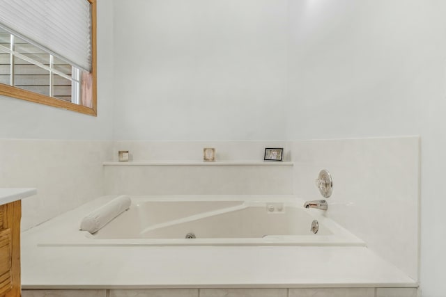 bathroom with vanity and a bathing tub