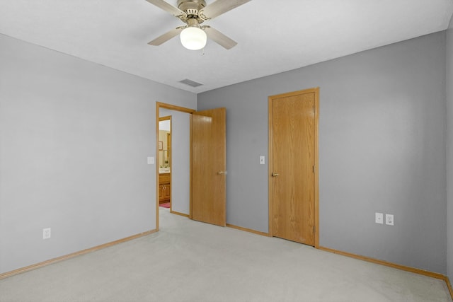 unfurnished room with ceiling fan and light colored carpet