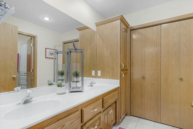 bathroom featuring tile patterned floors and vanity