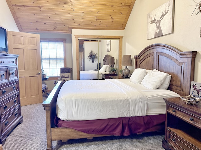 bedroom with light colored carpet, a closet, lofted ceiling, and wood ceiling