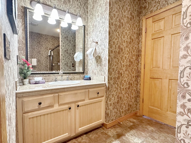 bathroom featuring vanity and a shower