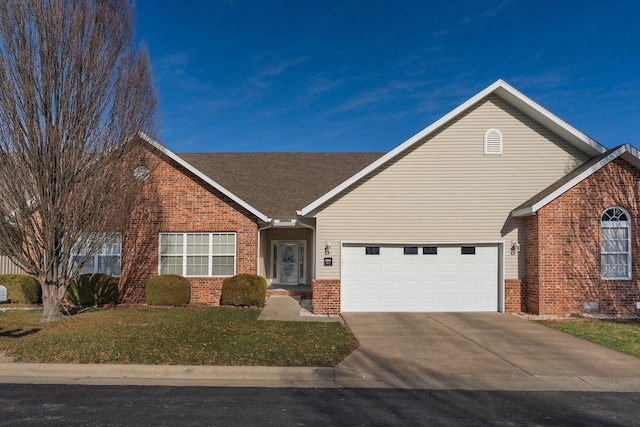 view of front facade featuring a front yard and a garage