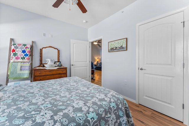 bedroom with ceiling fan and hardwood / wood-style flooring