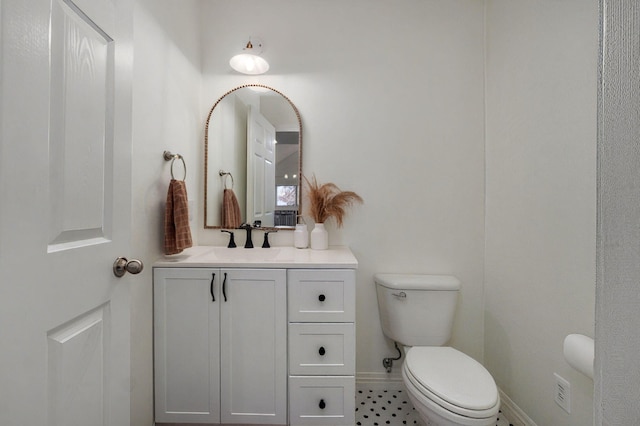 bathroom with toilet and vanity